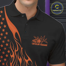 Load image into Gallery viewer, Male model at a bowling lane wearing a black bowling polo shirt with orange flame bowling strike artwork and patriotic graphics.