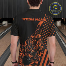 Load image into Gallery viewer, Back view of a male model in a bowling alley wearing a black polo shirt featuring an orange flaming bowling ball and patriotic pin design.