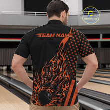 Load image into Gallery viewer, Front view of a male model in a bowling alley wearing a black quarter-zip shirt featuring an orange flaming bowling ball hitting the pins.