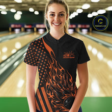 Load image into Gallery viewer, Female model at a bowling lane wearing a black bowling quarter-zip shirt with an orange flaming bowling ball hitting the pins and American flag artwork.