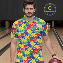 Load image into Gallery viewer, Male model in a bowling lane wearing a colorful polo shirt, front view featuring seamless multi-colored puzzle pattern design