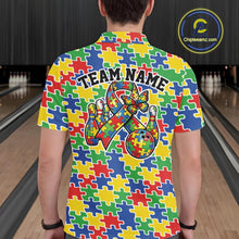 Load image into Gallery viewer, Male model at a bowling lane, back view of colorful polo shirt showcasing seamless puzzle piece print across the fabric