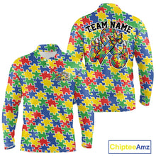 Load image into Gallery viewer, Close-up view of white shirt showcasing seamless multi-colored puzzle piece pattern in red, blue, green, and yellow with smooth repeating layout