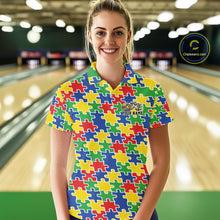 Load image into Gallery viewer, Female model in a bowling lane, front view wearing a colorful polo shirt with seamless multi-colored puzzle pattern design