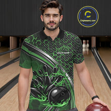 Load image into Gallery viewer, Male model in a bowling lane wearing a black and green polo shirt, featuring a honeycomb pattern with a flaming bowling ball striking pins.