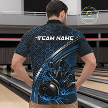 Load image into Gallery viewer, Male model in a bowling alley wearing a black and blue quarter zip shirt, showcasing honeycomb accents and a dynamic flame bowling strike illustration.