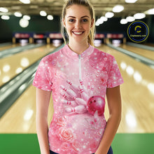 Load image into Gallery viewer, Female model at a bowling lane wearing a pink quarter zip bowling shirt with butterfly and sparkling diamond themed bowling artwork.