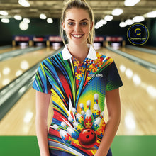 Load image into Gallery viewer, Female model in a bowling alley wearing a white polo shirt, front view featuring colorful autism bowling strike illustration with puzzle details