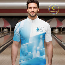 Load image into Gallery viewer, Male model front view in a bowling lane wearing a white and blue bowling quarter zip shirt with bowling ball and pins motif.