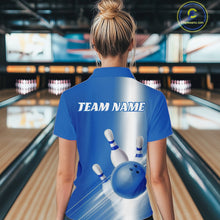 Load image into Gallery viewer, Female model back view in a bowling lane wearing a quarter zip shirt with bowling ball and pins flowing through a blue gradient pattern.