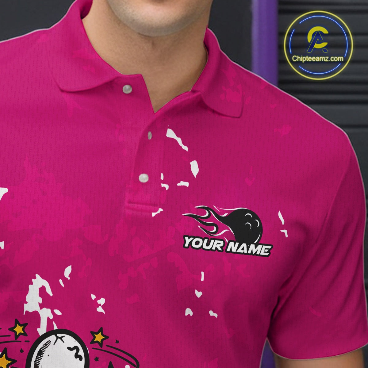 Close-up view of left chest area of a pink and white polo shirt, showing small detailed drunk bowling pin graphic with beer bottle and bowling ball.