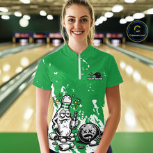 Load image into Gallery viewer, Front view female model in green and white quarter zip bowling shirt in bowling lane, playful beer drinking bowling pin graphic with splatter effect