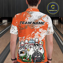 Load image into Gallery viewer, Back view of a male model in a bowling lane wearing an orange and white grunge splatter polo shirt featuring playful bowling pins and beer bottle illustration.
