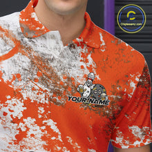 Load image into Gallery viewer, Close-up view of the left chest of an orange and white grunge splatter polo shirt showing cartoon bowling pins and beer bottle detail artwork.