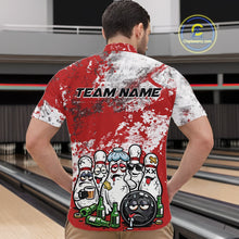 Load image into Gallery viewer, Male model at a bowling lane wearing a quarter zip shirt, front view showcasing red and white splatter design with playful bowling pins and bowling ball illustration