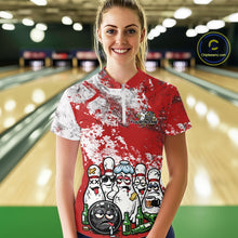 Load image into Gallery viewer, Front view of a female model in a bowling lane wearing a red and white grunge splatter bowling quarter-zip shirt, featuring playful cartoon bowling pins and beer bottle graphics.