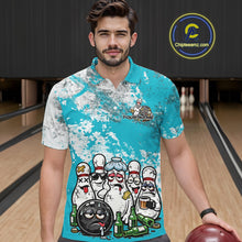 Load image into Gallery viewer, Front view of a male model in a bowling lane wearing a turquoise blue and white grunge splatter polo shirt with humorous cartoon bowling pins and beer bottles artwork.