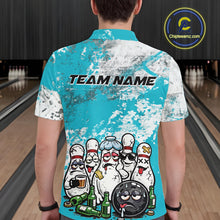 Load image into Gallery viewer, Back view of a male model in a bowling lane wearing a turquoise blue and white grunge splatter polo shirt featuring playful bowling pins and beer bottle illustration.