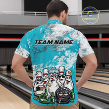 Load image into Gallery viewer, Male model at a bowling lane wearing turquoise blue and white quarter zip shirt, front view featuring cartoon bowling pins and beer bottle themed bowling illustration