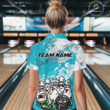 Load image into Gallery viewer, Back view of a female model in a bowling lane wearing a bowling quarter-zip shirt with turquoise blue and white grunge splatter design, featuring cartoon bowling pins and beer bottle graphics around a bowling ball.