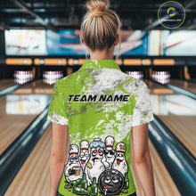Load image into Gallery viewer, Back view female model in bowling alley wearing white polo shirt featuring green and white grunge splatter, playful drunk bowling pins and beer bottle graphics