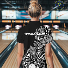Load image into Gallery viewer, Back view of a female model in a black and white bowling polo shirt featuring bowling ball and pin artwork surrounded by tribal swirls and turtle Polynesian patterns.