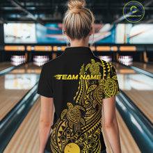 Load image into Gallery viewer, Back view of a female model in a black and gold bowling polo shirt displaying tribal bowling artwork and turtle pattern accents.