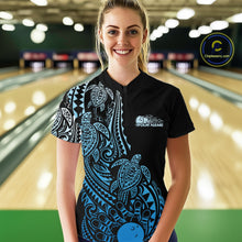 Load image into Gallery viewer, Female model wearing a black and blue bowling quarter-zip shirt at the bowling lane with tribal swirl accents and bowling artwork.