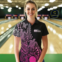 Load image into Gallery viewer, Female model wearing a black and pink bowling polo shirt at the lane with Polynesian-style bowling artwork and tribal details.