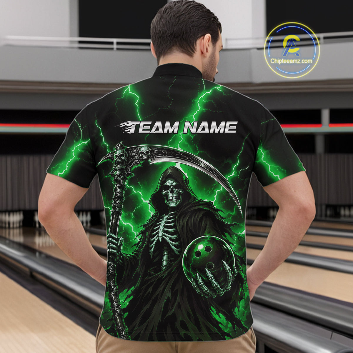 A man viewed from behind wearing a black short-sleeve bowling shirt with a green Grim Reaper graphic, lightning bolts, and the text 'TEAM NAME' across the upper back. Bowling lanes are visible in the background, and a circular 'Chileaniz.