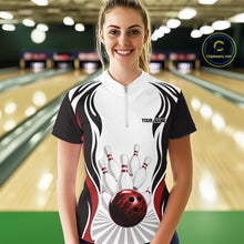 Load image into Gallery viewer, Front view of a female model inside a bowling center wearing a white, black, and red bowling quarter-zip shirt with bowling ball striking pins artwork.