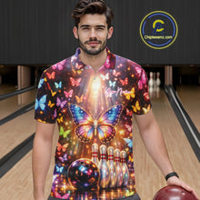 Load image into Gallery viewer, Male model wearing a bowling polo shirt at the bowling lane with colorful butterfly artwork, bowling pins, a bowling ball, and sparkling details.