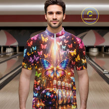 Load image into Gallery viewer, Male model at a bowling lane wearing a bowling quarter-zip shirt with colorful butterfly artwork, bowling pins, a bowling ball, and sparkling accents.
