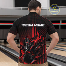 Load image into Gallery viewer, Front view of a male model in a bowling venue wearing a black and red quarter-zip shirt featuring a bowling strike motif with flame effects.