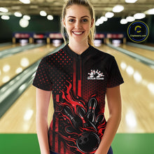 Load image into Gallery viewer, Female model wearing a black and red bowling quarter-zip shirt at a bowling lane with fiery bowling action artwork and patriotic graphics.