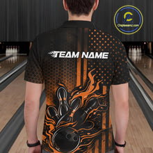 Load image into Gallery viewer, Back view of a male model in a bowling alley wearing a black and orange polo featuring a flaming bowling ball and pins design.