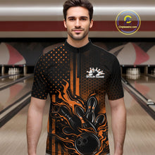 Load image into Gallery viewer, Male model at a bowling lane wearing a black and orange bowling quarter-zip shirt with fiery bowling strike graphics and patriotic styling.