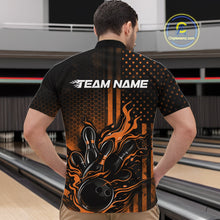 Load image into Gallery viewer, Front view of a male model in a bowling alley wearing a black and orange quarter-zip shirt showcasing a flaming bowling ball and bowling pins.