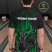 Load image into Gallery viewer, Back view of a male model in a bowling center wearing a black and green polo featuring flaming bowling ball and pin impact design.