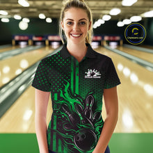Load image into Gallery viewer, Female model wearing a black and green bowling polo shirt at a bowling lane with bold bowling strike graphics and patriotic accents.