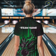 Load image into Gallery viewer, Back view of a female model in a bowling center wearing a black and green polo showcasing a bowling action motif with flames.