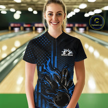 Load image into Gallery viewer, Female model at a bowling lane wearing a black and blue bowling quarter-zip shirt with fiery bowling action artwork and patriotic details.
