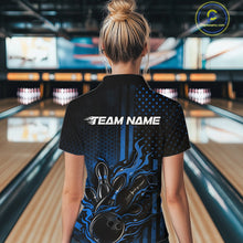 Load image into Gallery viewer, Back view of a female model in a bowling alley wearing a black and blue quarter-zip shirt showcasing a bowling strike motif with flame effects.