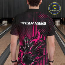 Load image into Gallery viewer, Back view of a male model in a bowling lane wearing a black and pink polo shirt featuring flames around a bowling ball striking pins in a patriotic American flag bowling style.