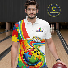 Load image into Gallery viewer, Male model in a bowling lane wearing a white polo shirt, front view showcasing autism-themed bowling lane illustration with colorful puzzle details
