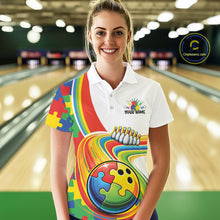 Load image into Gallery viewer, Female model in a bowling lane wearing a white polo shirt, front view featuring colorful autism-themed bowling lane artwork with puzzle-inspired graphics
