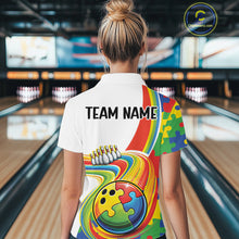 Load image into Gallery viewer, Female model at a bowling lane, back view wearing white polo shirt showcasing autism bowling lane design with vibrant puzzle elements