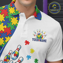 Load image into Gallery viewer, Close-up left chest detail of white bowling polo shirt showcasing colorful autism bowling strike emblem with puzzle accents