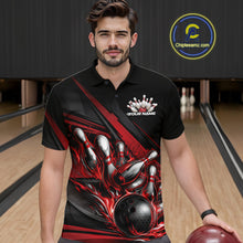 Load image into Gallery viewer, Male model in a bowling lane wearing black polo shirt, front view showcasing red flame bowling ball hitting pins with bold stripe design