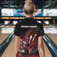Load image into Gallery viewer, Female model in a bowling venue, back view of black polo shirt featuring red flame bowling ball and abstract geometric stripe artwork